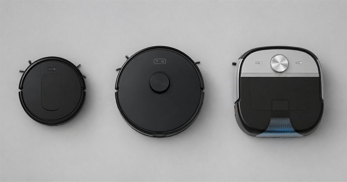 Three robot floor cleaners of increasing size and build quality lined up from above, representing entry, mid and premium price tiers